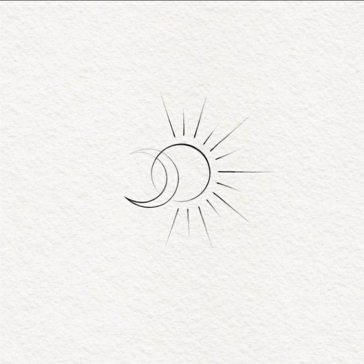 the sun and moon are drawn on paper