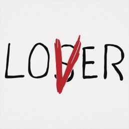 the word lover written in black and red ink