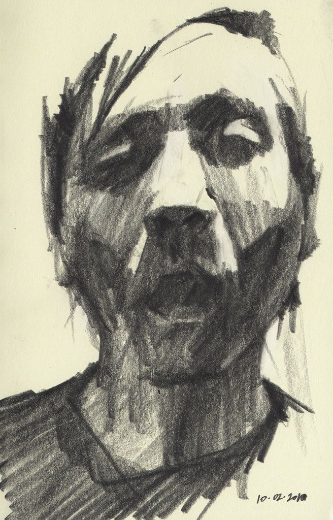 a black and white drawing of a man's face