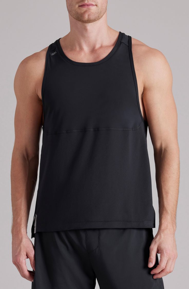 Dig deep through tough runs or heavy sets in the cool, breathable comfort of this mesh-fronted tank that works to keep you cool, dry and stink free. 28" length (size Medium) Crewneck Breathable mesh allows ventilation of excess heat for cooling comfort Moisture-wicking fabric engineered for dryness and comfort GoldFusion™ antimicrobial technology with gold nanoparticles is engineered to inhibit the growth of odor-causing germs and remains 99.9% effective for the lifetime of the garment 88% polye