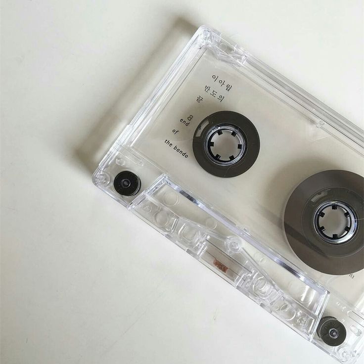 there are two black wheels on top of the plastic cassette player's tape dispenser