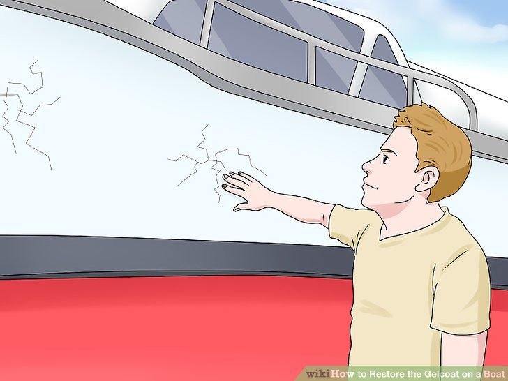 a boy pointing at something on the side of a boat