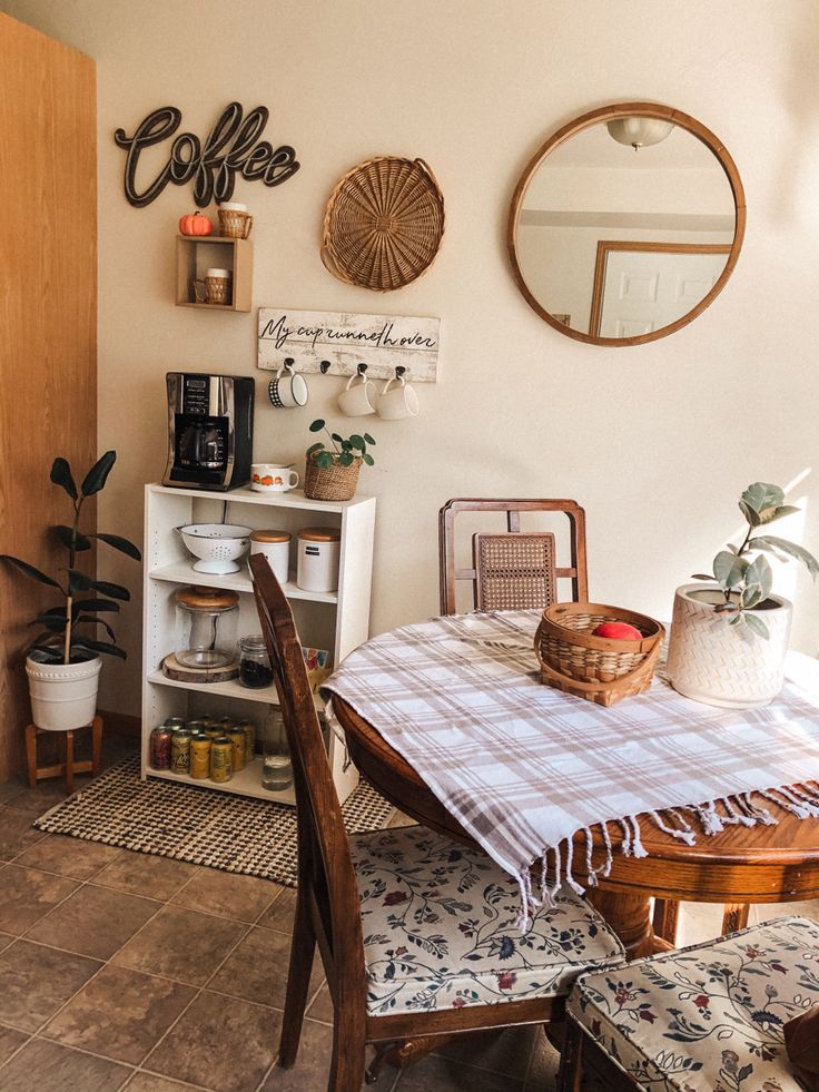 a dining room table and chairs with a checkered cloth on the tablecloth in front of it