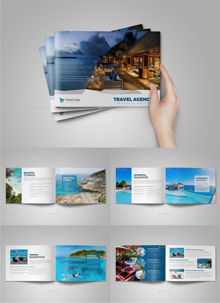 a hand holding an open travel brochure on top of a white surface with blue water