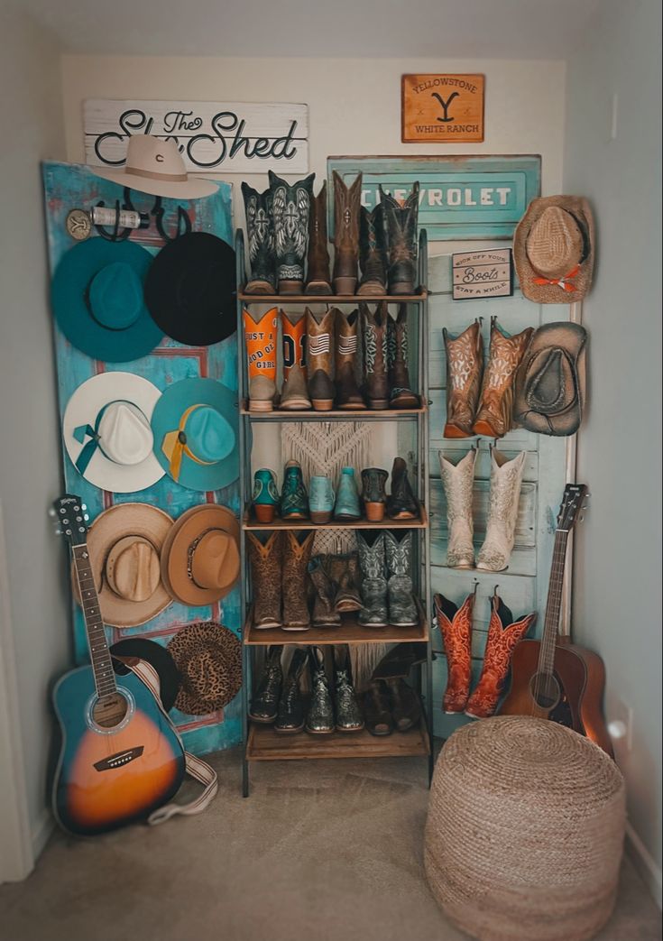 a room filled with lots of hats and boots on shelves next to a wall mounted guitar