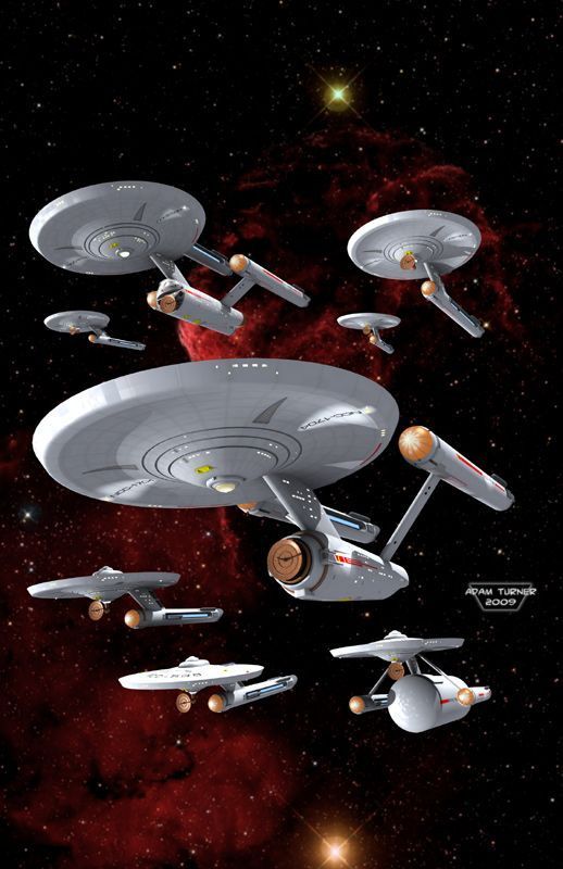 a group of star trek ships flying through space