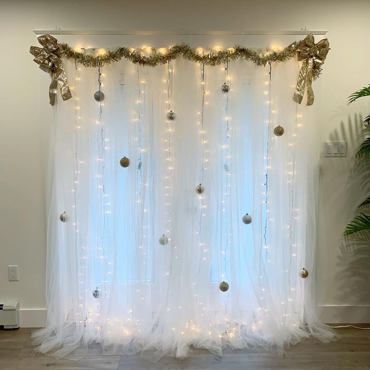 the curtain is decorated with lights and ornaments