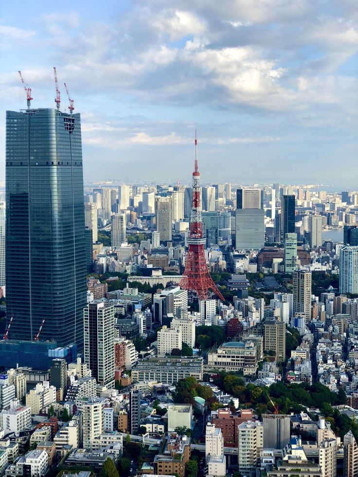 an aerial view of the city with skyscrapers and other tall buildings in the foreground