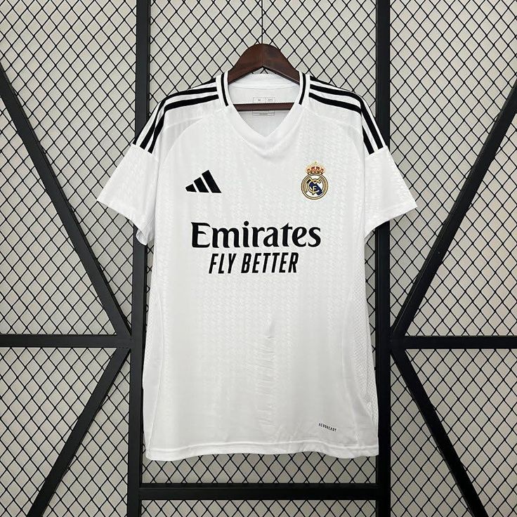 the real madrid jersey hanging on a wall