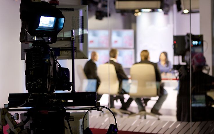 a camera set up with people in the background