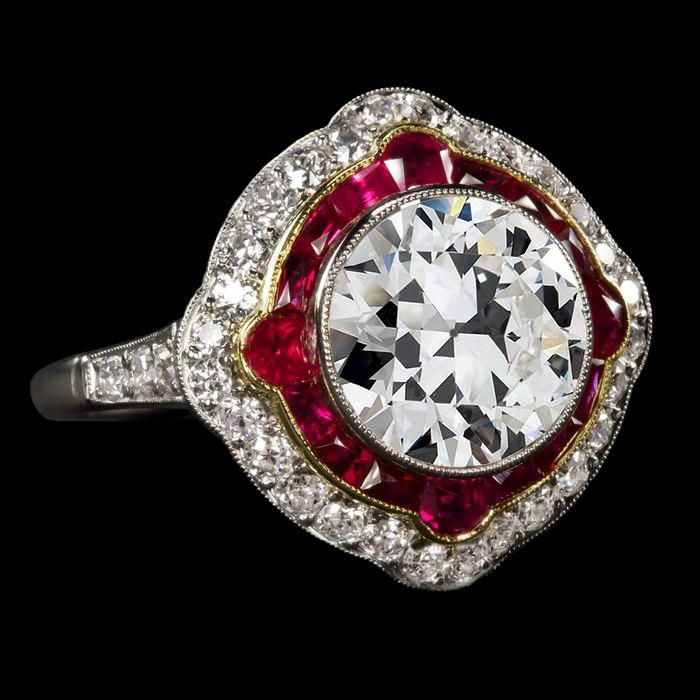 METAL SPECIFICATIONS Two Tone Gold 14K STONE SPECIFICATIONS Stone Name : Old Miner and Ruby Stone Cut : Round, Half Moon and Trapezoid Stone Details : There is one round cut old miner diamond approx. 3.50 carats (Approx. Dia. 9.5 mm) and approx. 3 carats of smaller stones on the sides. Natural earth mined stones. Color : F/G Clarity : VS1 Quality of Rubies : AAA Total : Approx. 6.50 Carats RING SPECIFICATIONS Size : 6.5 (Can ship in any size) Appraised Value : $65448.00 Comes with Certificate Princess Jewelry, European Cut Diamonds, Filigree Ring, Antique Diamond, Vintage Jewels, Bezel Diamond, Ruby Ring, Vintage Diamond, Statement Ring