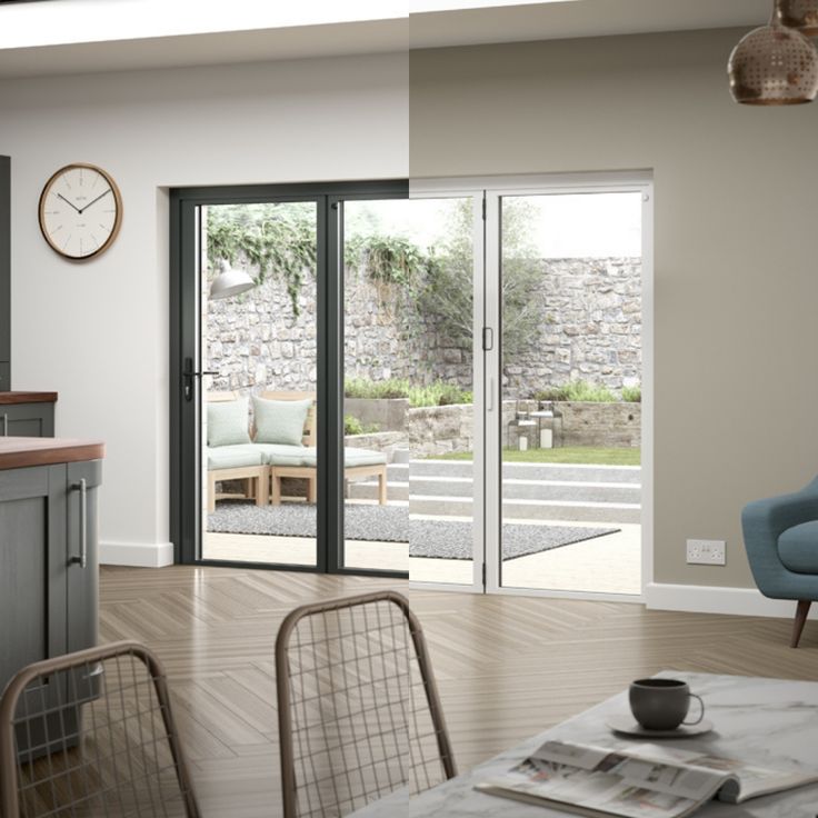 an open kitchen and living room with sliding glass doors