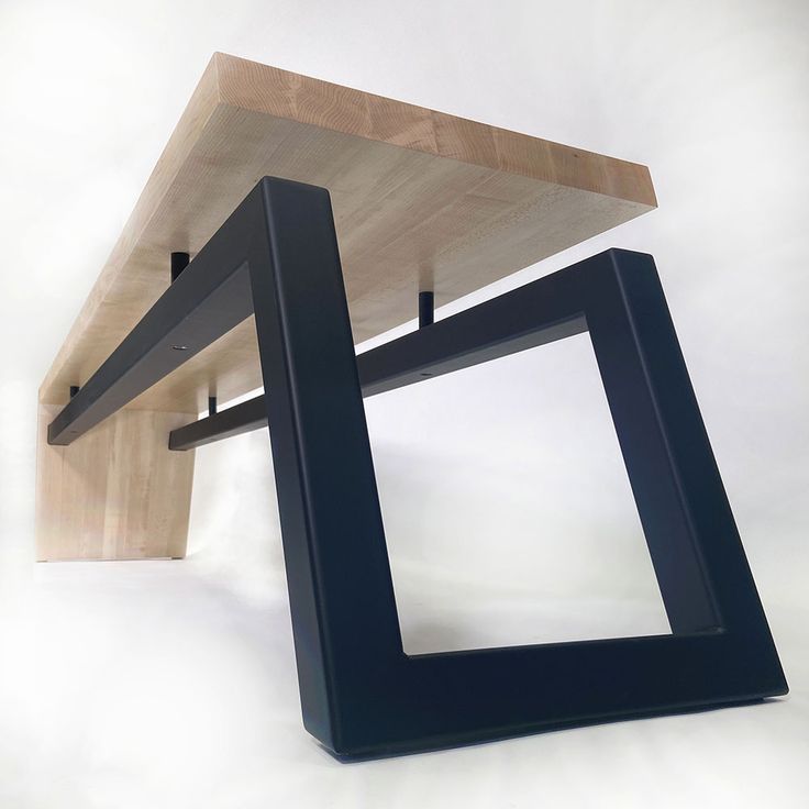 a wooden table with two black frames on it