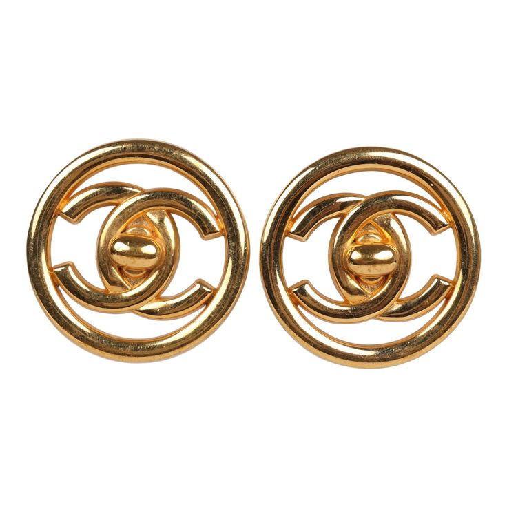 These Vintage CC Circle Turnlock Earrings are in 24K gold plated metal and feature the signature CC turnlocks. Origin: FranceCondition: Vintage; Excellent - These earrings show signs of wear with scratches and discoloration to the gold metal.Accompanied by: N/AMeasurements: 1.18" x 1.18" Designer Gold Metal Clip-on Earrings, Designer Gold-tone Logo Plaque Earrings For Formal Occasions, Designer Gold-tone Clip-on Earrings, Luxury Gold-tone Earrings With Logo Plaque, Classic Yellow Gold Earrings With Logo Plaque, Designer Gold Clip-on Jewelry, Luxury Gold Clip-on Earrings With Logo, Classic Gold Clip-on Earrings With Logo Plaque, Designer Gold Clip-on Round Earrings