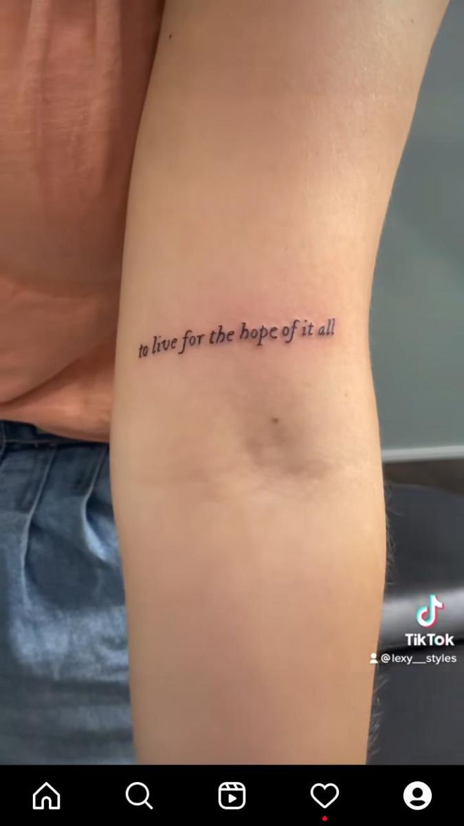 a person with a tattoo on their arm that says, in love for the shape of it all