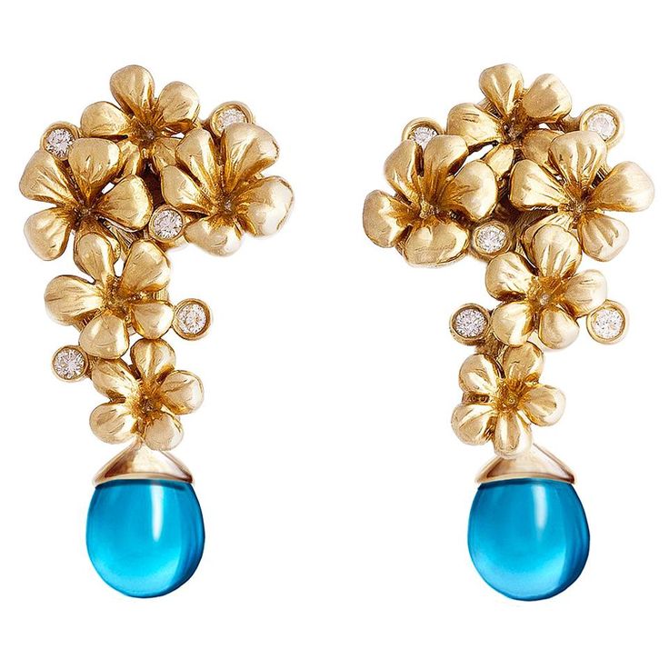 These Plum Blossom cocktail earrings with removable cabochon topaz drops are crafted from 18 karat yellow gold and feature 10 round diamonds. They are part of a collection that was featured in a Vogue UA review and inspired by the art nouveau flower motifs and the Asian tradition of blooming celebrations. The earrings were designed by oil painter Polya Medvedeva. The diamonds used are top natural diamonds VS, F-G, and the German gems company we work with has been in the market since the 19th cen Sculptural Flowers, Vogue Art, Topaz Yellow, Art Nouveau Earring, Cocktail Earrings, Contemporary Earrings, Jewellery Inspiration, Plum Blossom, Hanging Earrings