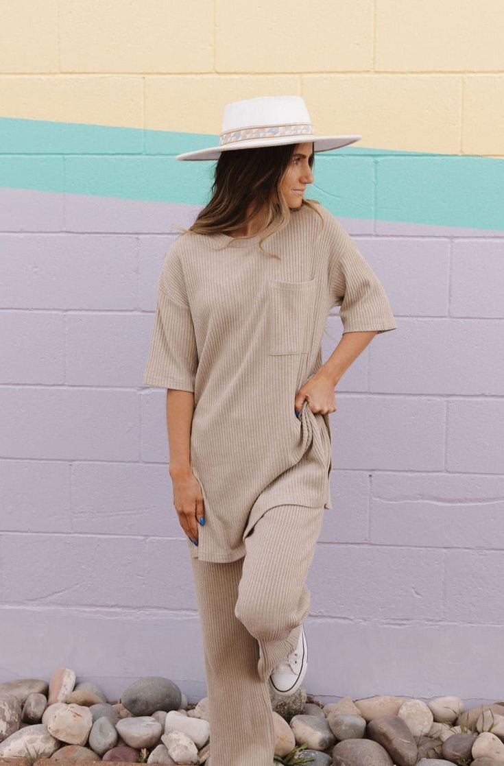 Elevate your loungewear game with the Essie Top-Sand. With its relaxed fit and side slits, this set provides ultimate comfort. The top features a chest pocket for added style. Perfect for a cozy night in or a day out. Color may differ slightly depending on lighting. *Relaxed fit* Material Content: 43% Rayon // 36% Polyester // 19% Nylon // 2% Spandex Material Pattern: Textured Bryn is 5’1” and wearing a small Model Measurements: Bryn: Height: 5’1” // Chest: 30” // Waist: 24” // Hips: 34 Not sure Comfortable Solid Color Sleepwear With Pockets, Comfortable Solid Sleepwear With Pockets, Cozy Sleepwear With Pockets For Loungewear, Cozy Loungewear Sleepwear With Pockets, Cozy Sleepwear With Pockets For Lounging, Summer Lounging Sleepwear With Pockets, Summer Sleepwear With Pockets For Lounging, Summer Sleepwear With Pockets For Relaxation, Casual Relaxed Fit Tops For Lounging