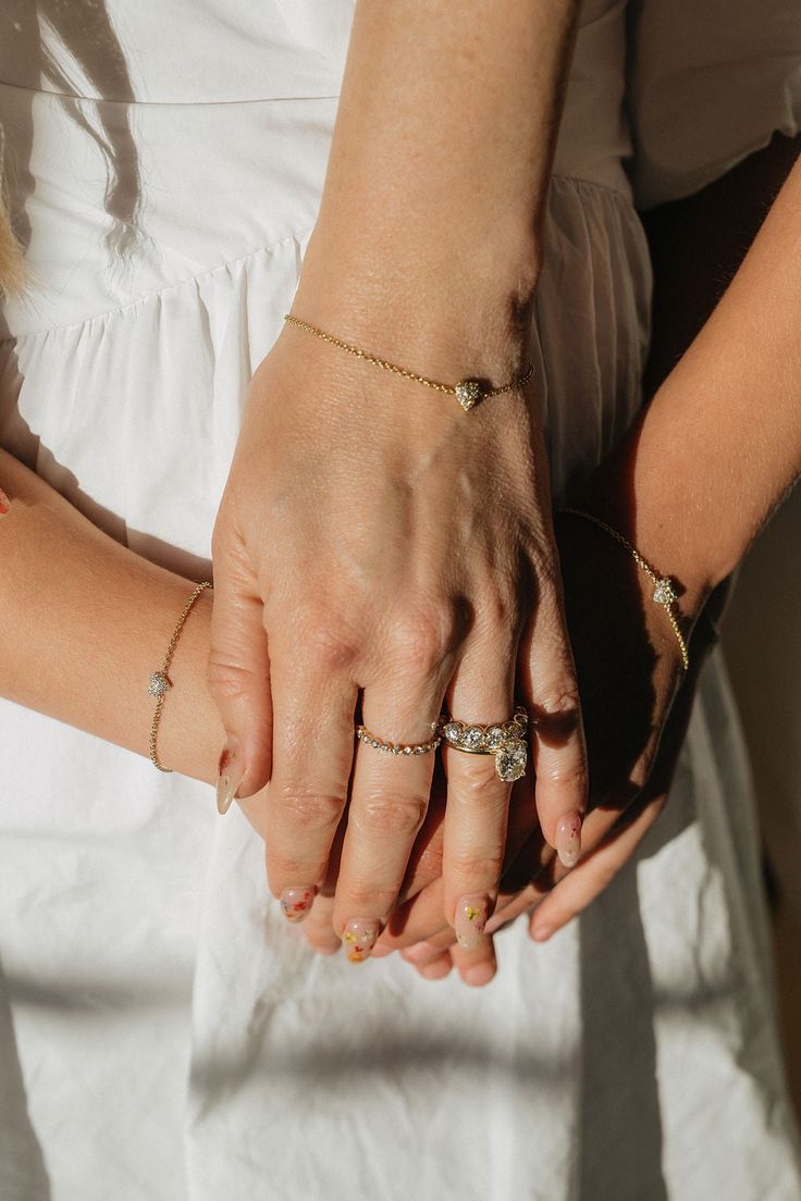 An heirloom diamond heart bracelet symbolizing true love. Each piece is hand-cast and handset in 14k solid yellow, white, or rose gold. Approximately .20 carat weight of high quality, round, brilliant diamonds in each heart (G color & VS clarity white diamonds). The Italian-milled chain is dainty, yet extremely durable. Adjustable length allows for a range of sizes and should fit most wrists. Adult/Mama Sizing: 6'' - 6.75'' max length Custom lengths and additional links are available free of cha Everyday Rose Gold Jewelry With Single Cut Diamonds, Heart-shaped Diamond Bracelet For Wedding, Diamond White Birthstone Jewelry For Promise, Diamond White Jewelry With Birthstone For Promise, White Birthstone Jewelry For Promise, Valentine's Day Promise Jewelry With Single Diamond, Everyday Rose Gold Diamond Jewelry, Gold Heart Bracelet With Diamond Accents For Gift, Adjustable 14k Gold Diamond Bracelet For Anniversary