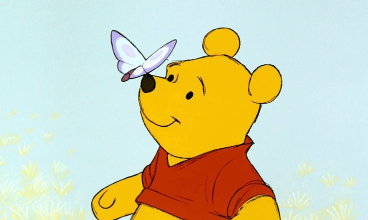 a winnie the pooh character with a butterfly on his nose and chest, standing in front of a blue sky