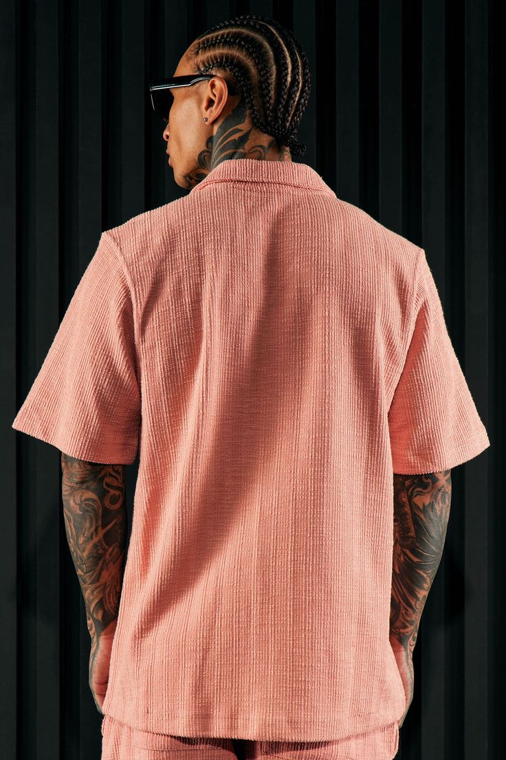 Model Height: 6'4 - Wearing Large Big & Tall: Height 6'5 - Wearing XXXL Available In Mauve. Fold Down Collar Front Button Closure Short Sleeve 62% Cotton, 38% Polyester Pair With "Dean Textured Slim Pant" Imported | Mens Dean Textured Short Sleeve Button Up Shirt in Mauve size Small by Fashion Nova Collared T-shirt With Button Closure For Spring, Pink Relaxed Fit Collared Short Sleeve Shirt, Pink Collared Short Sleeve Shirt With Relaxed Fit, Spring Collared T-shirt With Button Closure, Pink Summer Tops With Placket, Pink Relaxed Fit Collared Camp Shirt, Pink Collared Camp Shirt For Casual Wear, Casual Pink Collared Camp Shirt, Pink Short Sleeve Tops With Placket