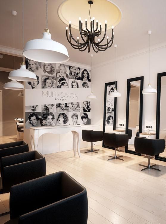 a salon with chairs, mirrors and chandelier hanging from the ceiling in front of it