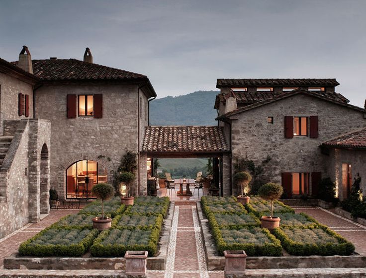 an outdoor garden with steps leading to two buildings