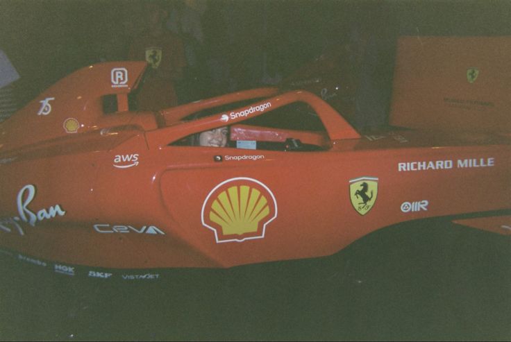 a red race car with the shell painted on it