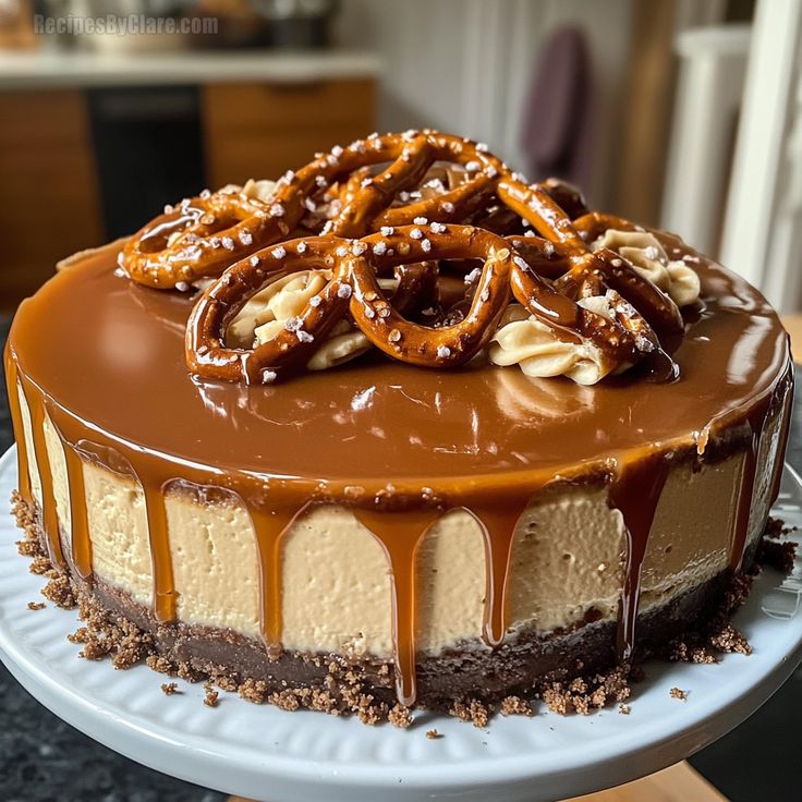 a chocolate cake with pretzels and nuts on top