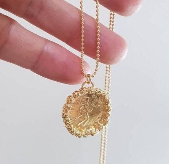 Gold coin necklace, gold  pendant necklace, 14k gold necklace, antique coin necklace, medallion necklace,  long coin necklace Long 14k gold filled necklace with an antique gold coin pendant, decorated with golden hammered beads. Beautiful minimalist round pendant, designed in an antique style, this gold coin medallion necklace is just  a great gift for her. It will be your to go necklace, for day or night, never needing to to take it off. Dimensions: The coin medallion pendant diameter is about Gold Plated Engraved Coin Medallion Necklace, Engraved Coin Medallion Gold Plated Necklace, Gold Coin-shaped Medallion Necklace With Locket, Gold Long Medallion Necklace With Coin Pendant, 14k Gold Medallion Necklace With Coin Pendant, Brass Coin Medallion Necklace, Brass Medallion Coin Necklace, Gold Plated Medallion Locket Coin Necklace, Gold Plated Medallion Coin Necklace With Locket