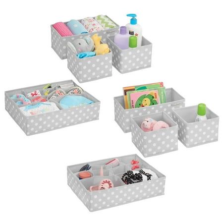 four bins with various items in them on a white background and one is filled with toys