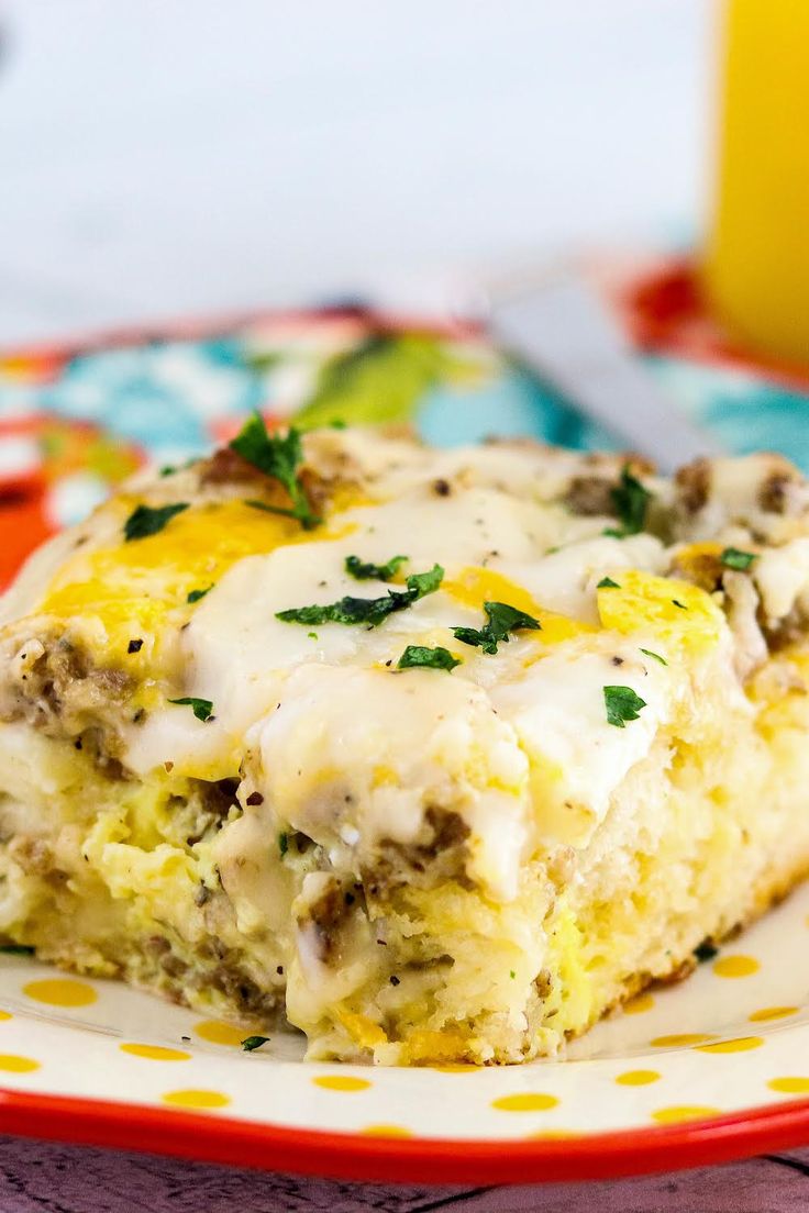 a close up of a plate of food with broccoli and cheese on it