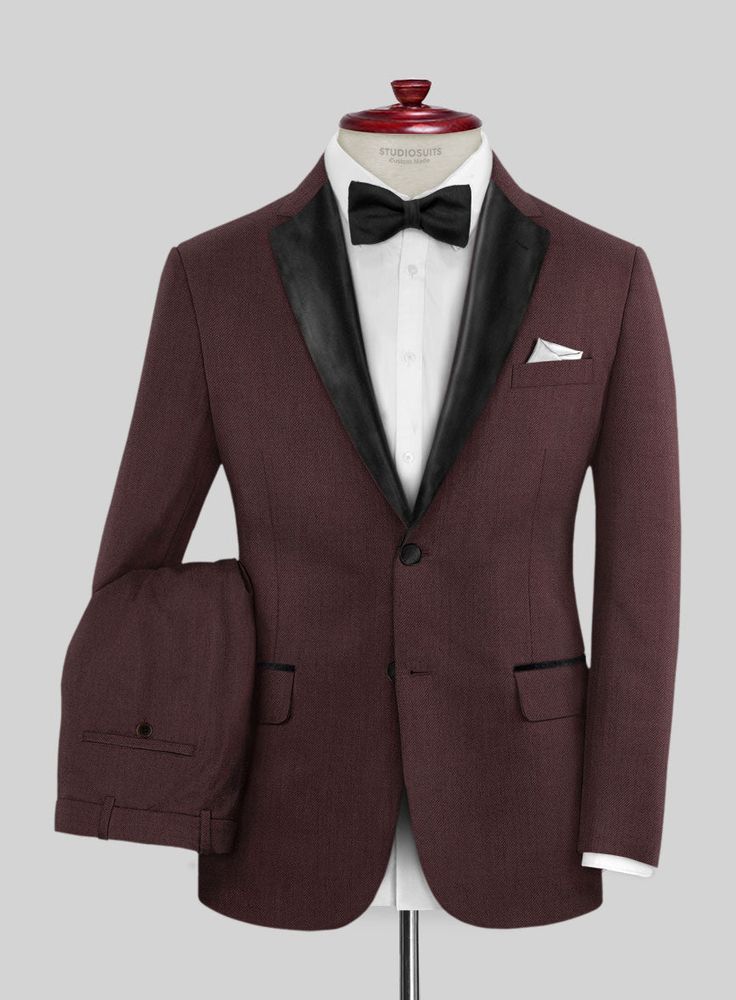 Make your presence felt in style with this wine tuxedo suit offering style and sophistication effortlessly with sleek style. Crafted from wool blend, the tuxedo suit is a trending essential you will surely need to pump up your elegant style personality.  Featuring satin lapel, matching satin covered buttons and gentle texture at its surface, our tuxedo is a subtle fashion-forward take on a traditional tailoring.  Look Includes   Napolean Wine Wool Fabric  Two Button Tuxedo Jacket Style  Notch Lapel  Black Tuxedo Buttons  Single Vent  Three Cuff Buttons  Two Welted Back Pockets on Trousers   Click 'Customize Now' to modify the look if needed.  Jacket is fully lined while the Pants do not have satin lining.  Lining: Viscose; Dry Clean. Tailored Burgundy Tuxedo For Business, Burgundy Tailored Tuxedo For Formal Occasions, Burgundy Tailored Tuxedo For Business, Tailored Burgundy Business Tuxedo, Custom Fit Tuxedo Suits For Tailoring, Burgundy Single Breasted Suit With Suit Collar, Burgundy Single-breasted Suit With Suit Collar, Fitted Burgundy Tuxedo For Business, Burgundy Fitted Tuxedo For Business