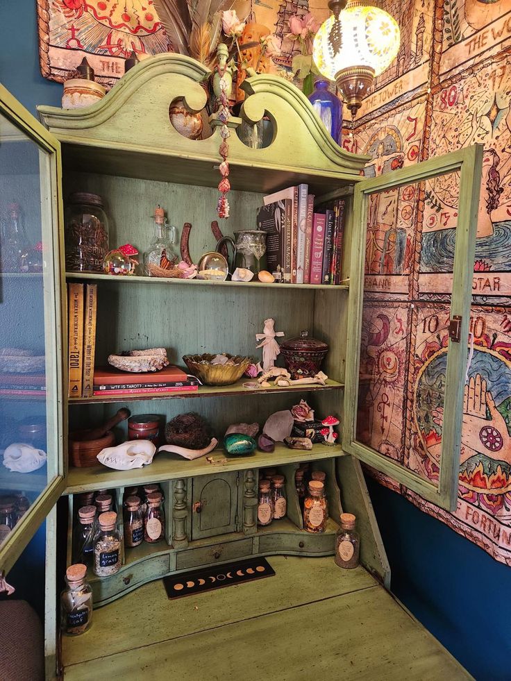 an old china cabinet with many items on it