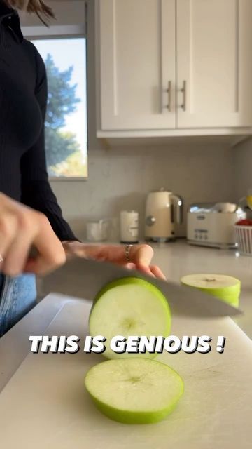 a woman cutting up some cucumbers on top of a kitchen counter with the caption, this is genius