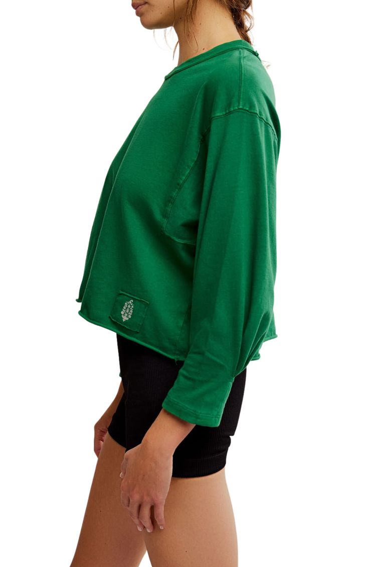 Love to layer in this soft cotton top designed with a classic crewneck and dropped shoulders. 21 1/2" length (size Medium) Crewneck Long sleeves 100% cotton Machine wash, tumble dry By Free People; imported Green Cotton Crew Top, Green Cotton Crew Neck Top, Soft-washed Cotton Top With Drop Shoulder, Soft-washed Cotton Drop Shoulder Top, Oversized Crew Neck Top In Organic Cotton, Oversized Organic Cotton Crew Neck Top, Sporty Cotton Top For Layering, Basic Crew Neck Top For Layering, Green Organic Cotton Top For Loungewear