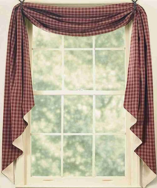 a red and white checkered curtain hanging on the side of a window sill