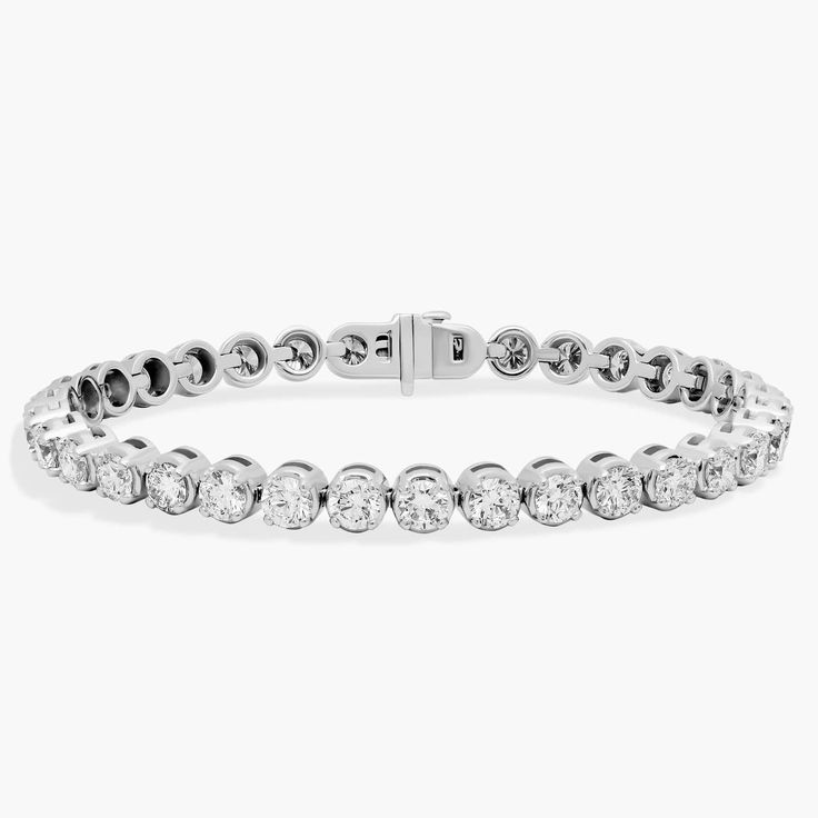 Unmatched in pure elegance, this eternity bracelet showcases forty round brilliant lab-grown diamonds set in a substantial 14k white gold bracelet, a truly iconic gift. White Diamond Jewelry, Eternity Bracelet, Pearl Jewelry Gift, Platinum Chain, Platinum Rose Gold, Bracelet Diamond, Pure Elegance, Gold Rings Fashion, Diamond Tennis Bracelet