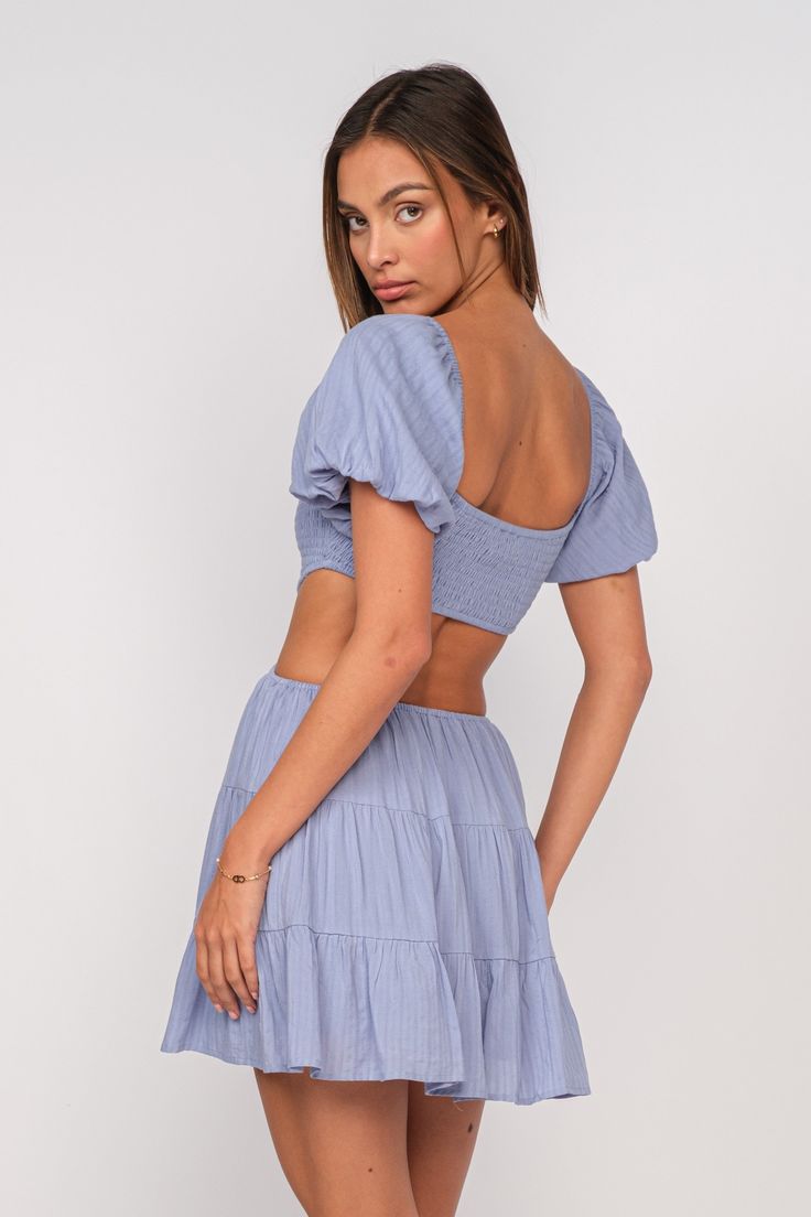 DETAILS: *This Dress runs short* ♡ Blue Cutout Dress ��♡ 100% Rayon ♡ Model is wearing a size Small ♡ Small (0-2), Medium (4-6), Large (8-10) Blue Mini Dress With Smocked Back And Square Neck, Blue Knee-length Dress With Smocked Back, Light Blue Mini Dress For Vacation, Light Blue Mini Dress For Day Out, Light Blue Mini Dress With Short Sleeves For Beach, Blue Mini Dresses For A Day Out, Light Blue Short Sleeve Mini Dress For Beach, Cute Blue Short Sleeve Mini Dress, Blue Cotton Mini Dress With Ruffles