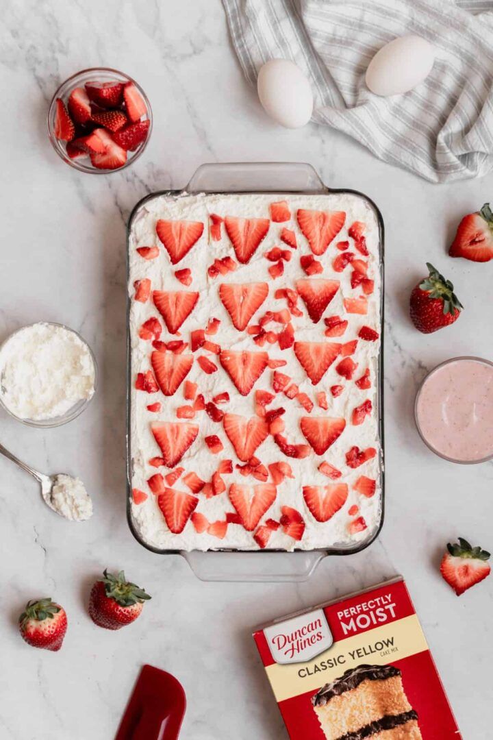 strawberry shortcakes with cream cheese frosting and fresh strawberries on the side