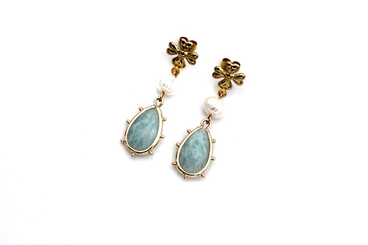 These amazonite earrings have dreamy garden party vibes, just waiting for the perfect dress to pair with them. They feature white fresh water pearl beads paired with gorgeous amazonite teardrop charms. Each earring is topped with a flower-shaped stainless steel post. Please note that each of the amazonite charms are unique and no two are alike. MATERIALS Amazonite Charms Fresh Water Pearl Beads Stainless Steel Ear Posts LENGTH 1 3/4" CARE Direct contact with perfumes and moisture should be avoid Elegant Amazonite Dangle Jewelry, Elegant Amazonite Earrings As A Gift, Elegant Amazonite Earrings For Gift, Amazonite Earrings, Dreamy Garden, Steel Post, Fresh Water Pearl, Flower Shape, Pearl Beads