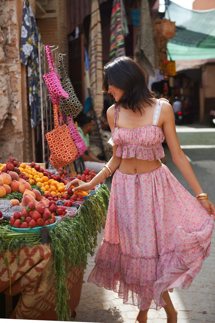 Ariana floral matching set is a harmonious mix of sweet and sophisticated. The pink floral pattern is vibrant and enchanting, reminiscent of a springtime garden in full bloom. Details: Spring/Summer romantic matching set Featuring ruffle details Crop-top with decorative shoulder strapsDeep boat neck with ruching details Elastic band on top of breast and beneath breast line to prevent from rollingMidi skirt is flowy and comfortable Elastic waistband Slip-on styling Fully lined Composition: Shell: Casual Ruffle Hem Sets For Spring, Casual Spring Sets With Ruffle Hem, Summer Casual Sets With Ruffle Hem, Casual Summer Sets With Ruffle Hem, Pink Sleeveless Ruffled Set, Feminine Summer Sets With Ruffles, Casual Spring Sets With Tiered Skirt, Multicolor Summer Sets With Floral Print, Multicolor Floral Print Summer Sets