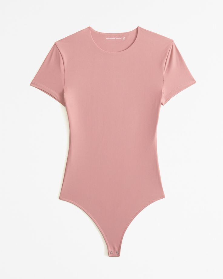 Women's Soft Matte Seamless Tee Bodysuit | Women's New Arrivals | Abercrombie.com Seamless Construction Bodysuit With Minimal Stretch, Seamless Bodysuit With Minimal Stretch, Fitted Short Sleeve Smoothing Bodysuit, Solid High Stretch Short Sleeve Seamless Bodysuit, High Stretch Seamless Solid Short Sleeve Bodysuit, Stretch Short Sleeve Bodysuit With Smoothing Details, Short Sleeve Smoothing Stretch Bodysuit, Solid Short Sleeve Stretch Bodysuit With Smoothing, Basic Solid Short Sleeve Stretch Bodysuit