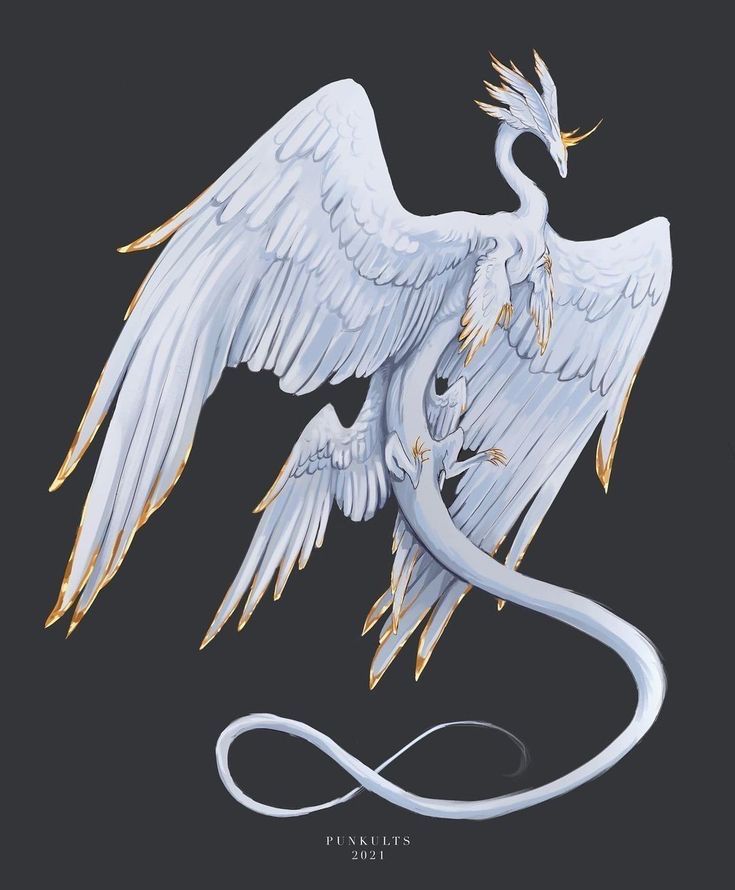 a white bird with gold accents on it's wings