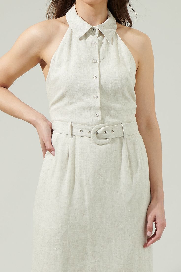 Create a cool look on the spot with the Rina Linen Halter Midi Dress! A nice dress that has a collared neck along with button down details in the front, sleeveless, and a belt around the waist. The open back makes is look more pretty and the pockets are convenient. Pick your favorite heels and you’re ready to go! - Halter- Belted- Pockets- Open back - Comes in 2 colorsSize + Fit - Model is 5'8" and wearing size XS- Measurements taken from size S - Chest: 19"- Length: 44 1/2" Fabric Self:70% Poly Chic Belted Dress With Belt Loops, Sleeveless Beige Belted Midi Dress, Fitted Summer Midi Dress With Belt, Fitted Midi Dress With Belt For Summer, Summer Mini Length Belted Dress, Fitted Sleeveless Midi Dress With Belt, Fitted Beige Belted Summer Dress, Chic Spring Belted Dress, Fitted Beige Belted Dress For Summer