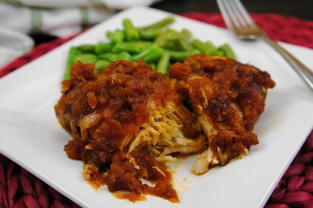 a white plate topped with lasagna and green beans