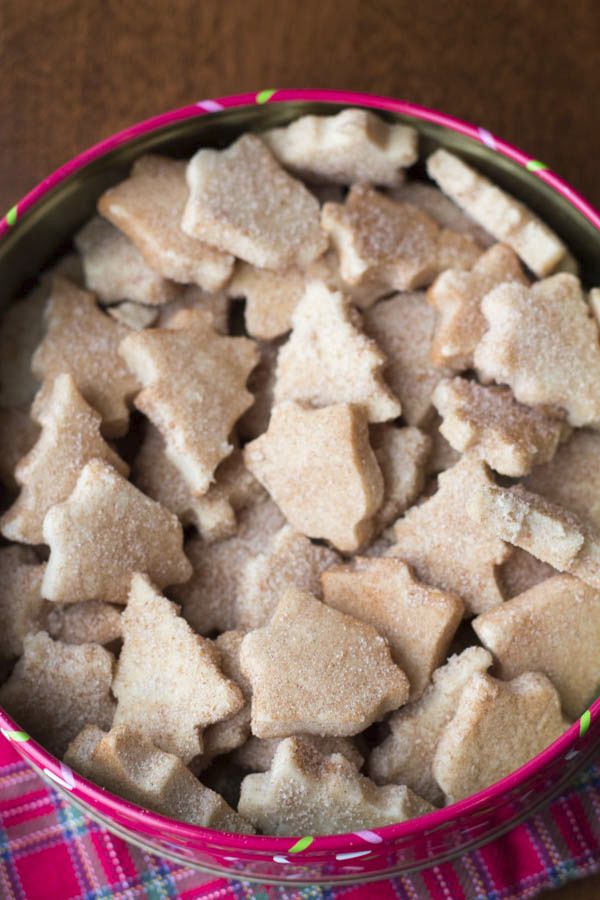 a pink bowl filled with cut up sugar cookies