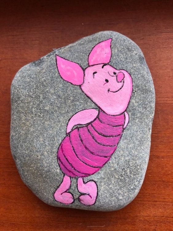 a rock with a drawing of a pig on it