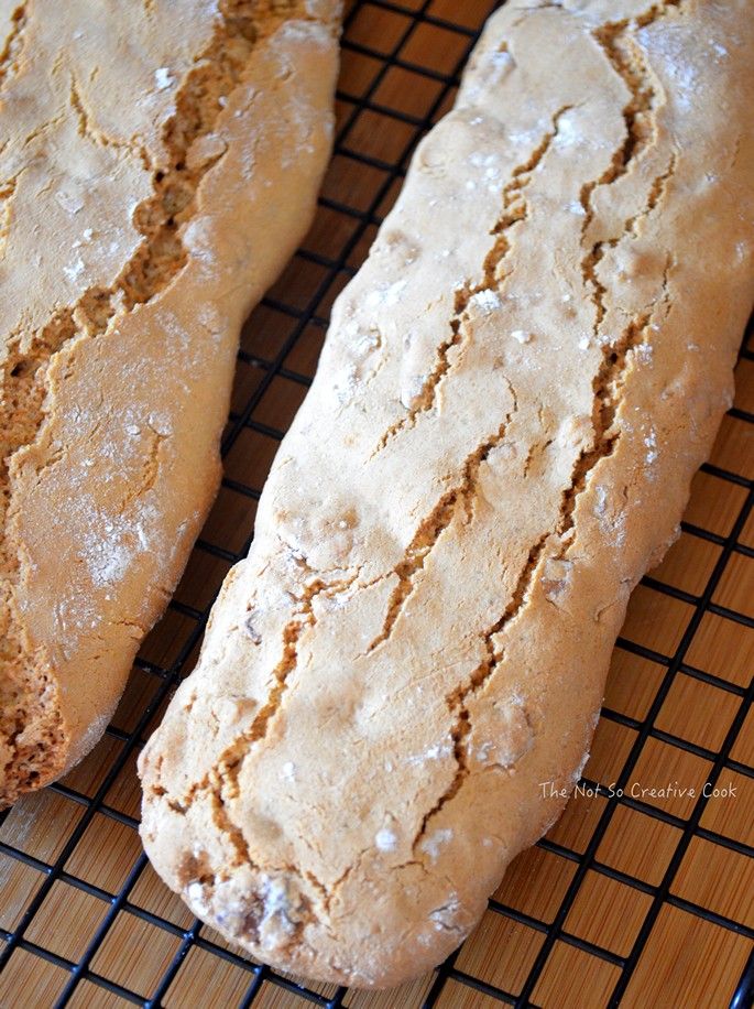 two loaves of bread sitting on top of a cooling rack