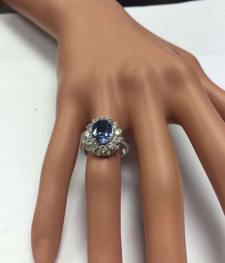 4.75 Carats Natural Very Nice Looking Tanzanite and Diamond 14K Solid White Gold Ring Suggested Replacement Value: $8,000.00 Total Natural Oval Cut Tanzanite Weight is: 3.50 Carats Tanzanite Measures: 9.00 x 7.00mm Natural Round Diamonds Weight: 1.25 Carats (color G-H / Clarity SI1-SI2) Ring total weight: 5.8g Disclaimer: all weights, measurements and colors are approximate and may vary slightly from the listed dimensions or as seen in the image. All pictures are magnified to show the smallest o Formal Oval Diamond Gemstones, Elegant Pear-shaped Gemstones For Formal Occasions, Oval Diamond Gemstones For Formal Occasions, Formal Platinum Gemstones Fine Jewelry, Fine Jewelry Platinum Gemstones For Formal Occasions, Formal Multi-stone Cubic Zirconia Gemstones, Oval Center Stone Gemstones For Formal Occasions, Elegant Pear-shaped Gemstones For Anniversary, Dazzling Diamond Ring With Accent Stones For Formal Occasions