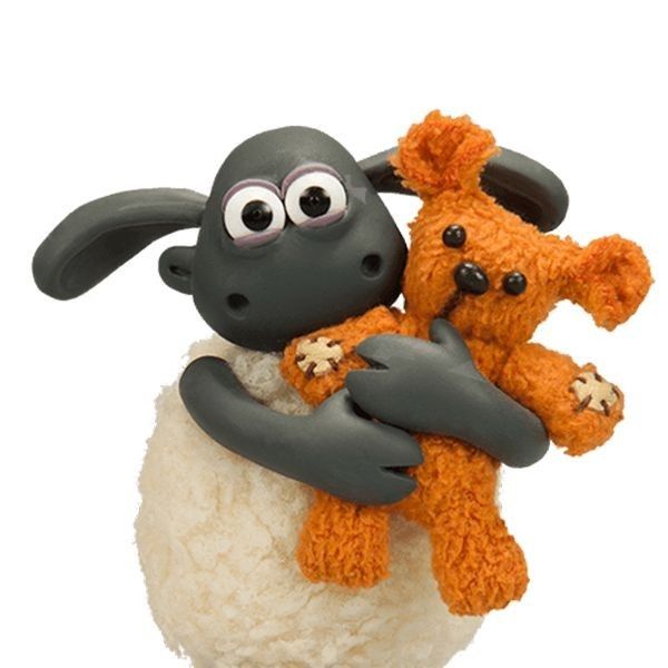 two stuffed animals sitting on top of each other in the shape of sheep and lambs